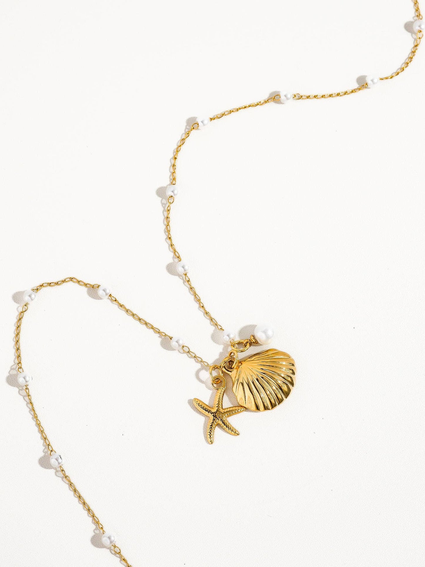 Capella Gold Seashell & Sea Star Pearl Necklace